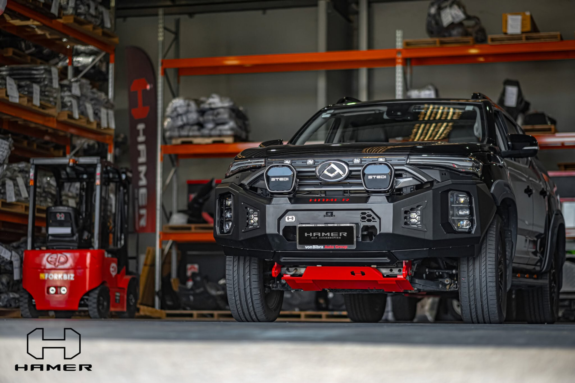 Dual cab ute fitted with a modern black alloy bull bar and light pods