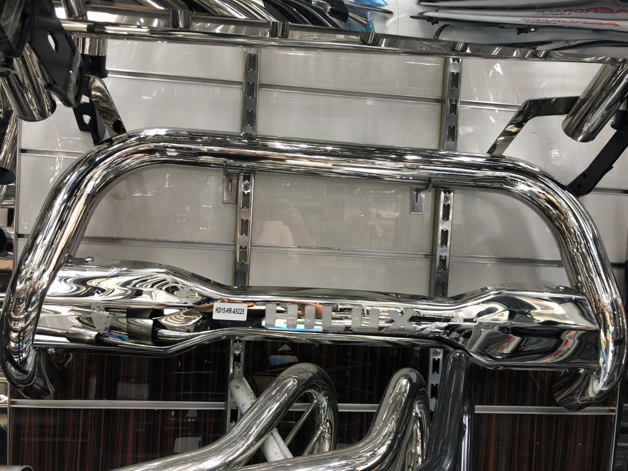 Polished HiLux nudge bar on the workshop display wall